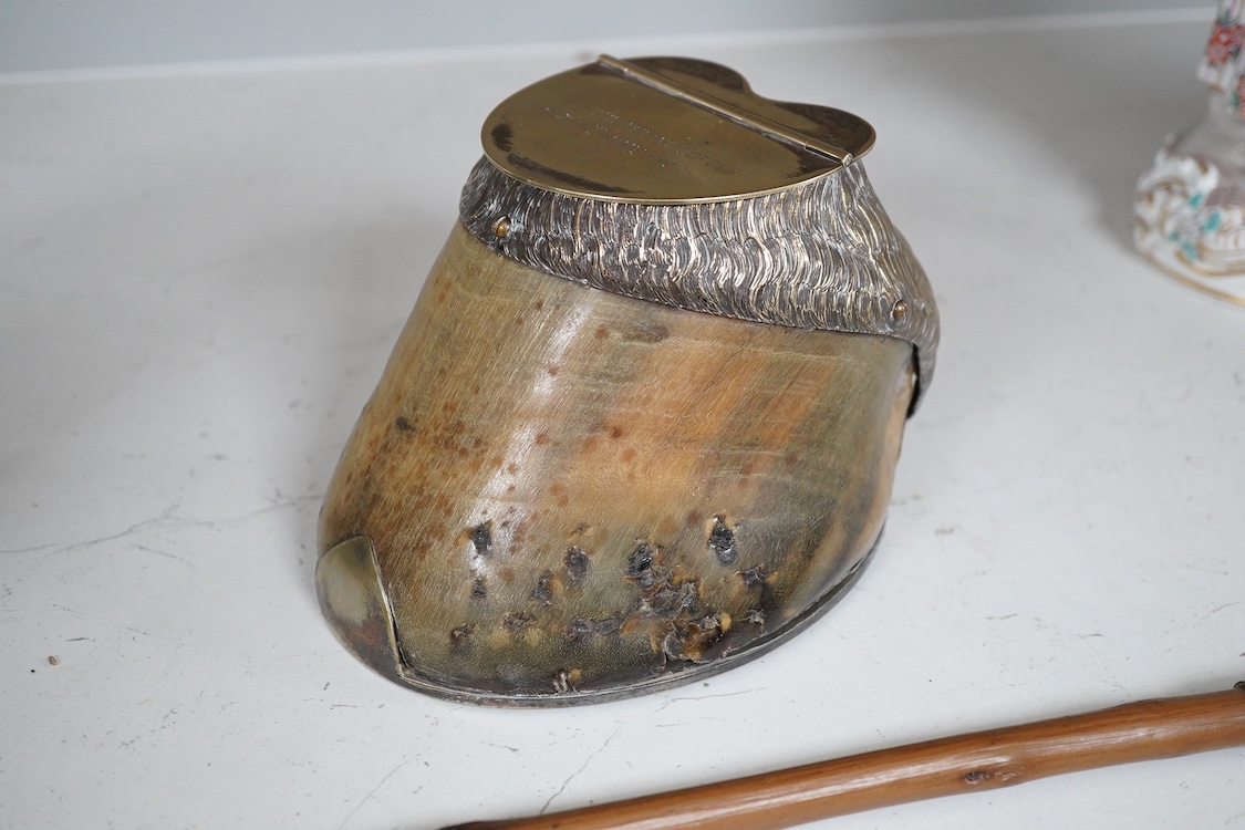 A Victorian electroplate mounted memorial horse hoof inkwell, 11cm high and a white metal mounted riding crop